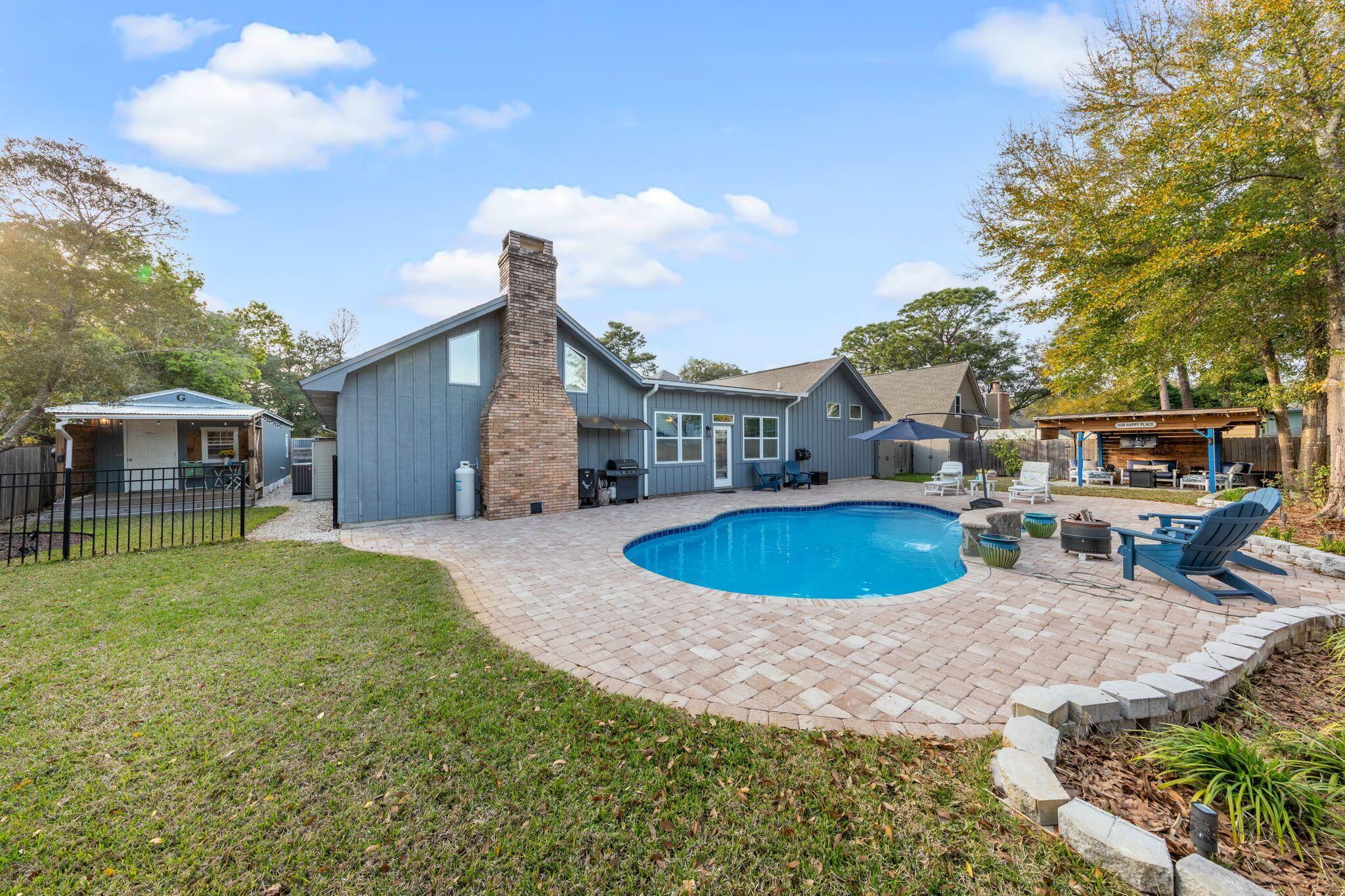 11 Hampton Circle Niceville, FL 32578 - Photo 60 of 79 a view of a house with backyard and sitting area