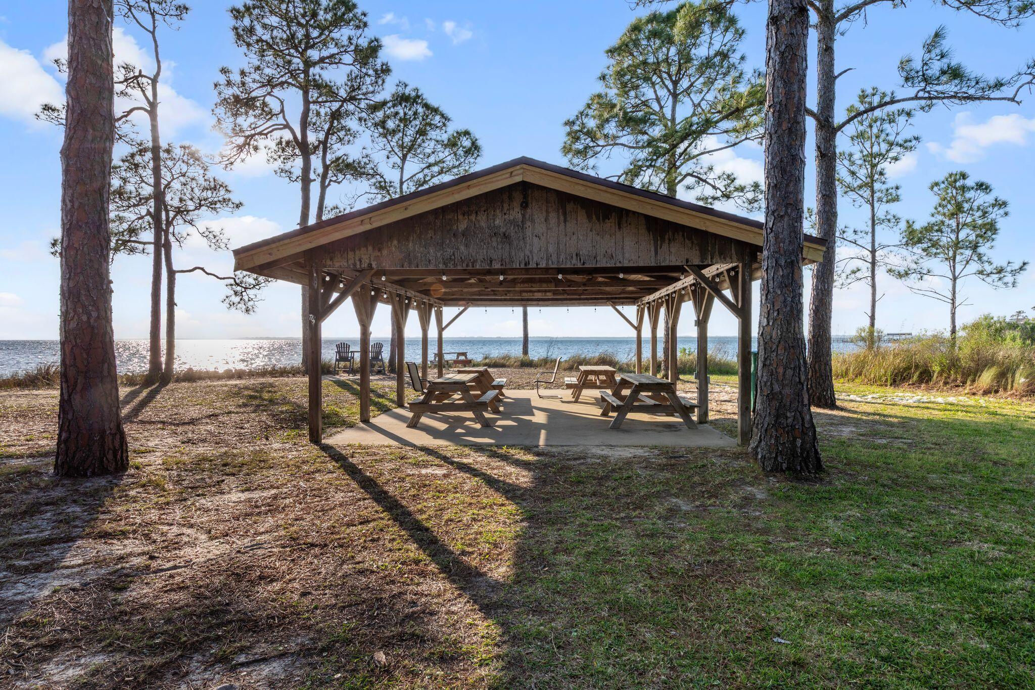 11 Hampton Circle Niceville, FL 32578 - Photo 71 of 79 a view of a outdoor space with trees and sitting area