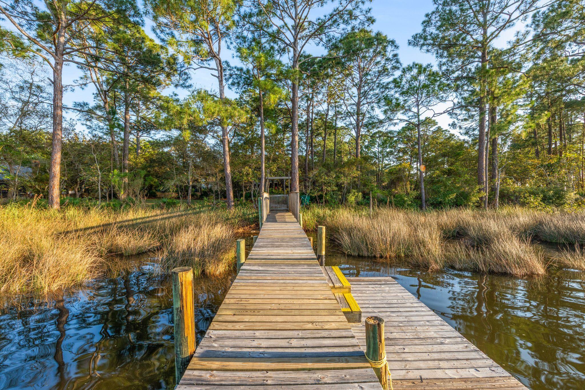 11 Hampton Circle Niceville, FL 32578 - Photo 77 of 79 a lake view with a wooden bridge