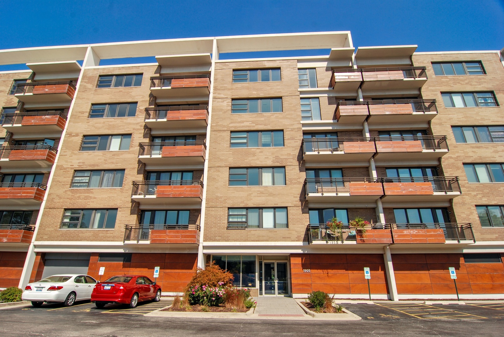1905 South Wolf Road, Unit 605 Hillside, IL 60162 - Photo 1 of 31 a front view of a building with lot of windows