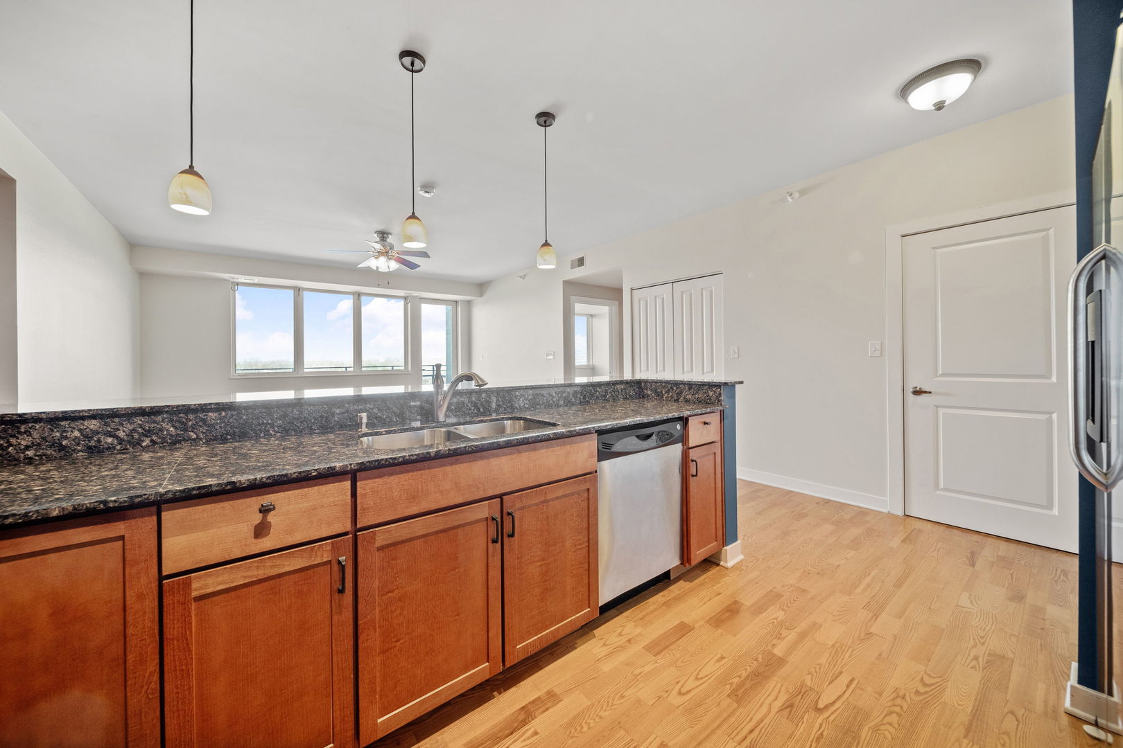 1905 South Wolf Road, Unit 605 Hillside, IL 60162 - Photo 11 of 31 a kitchen with stainless steel appliances granite countertop a sink a refrigerator a stove and a wooden floors