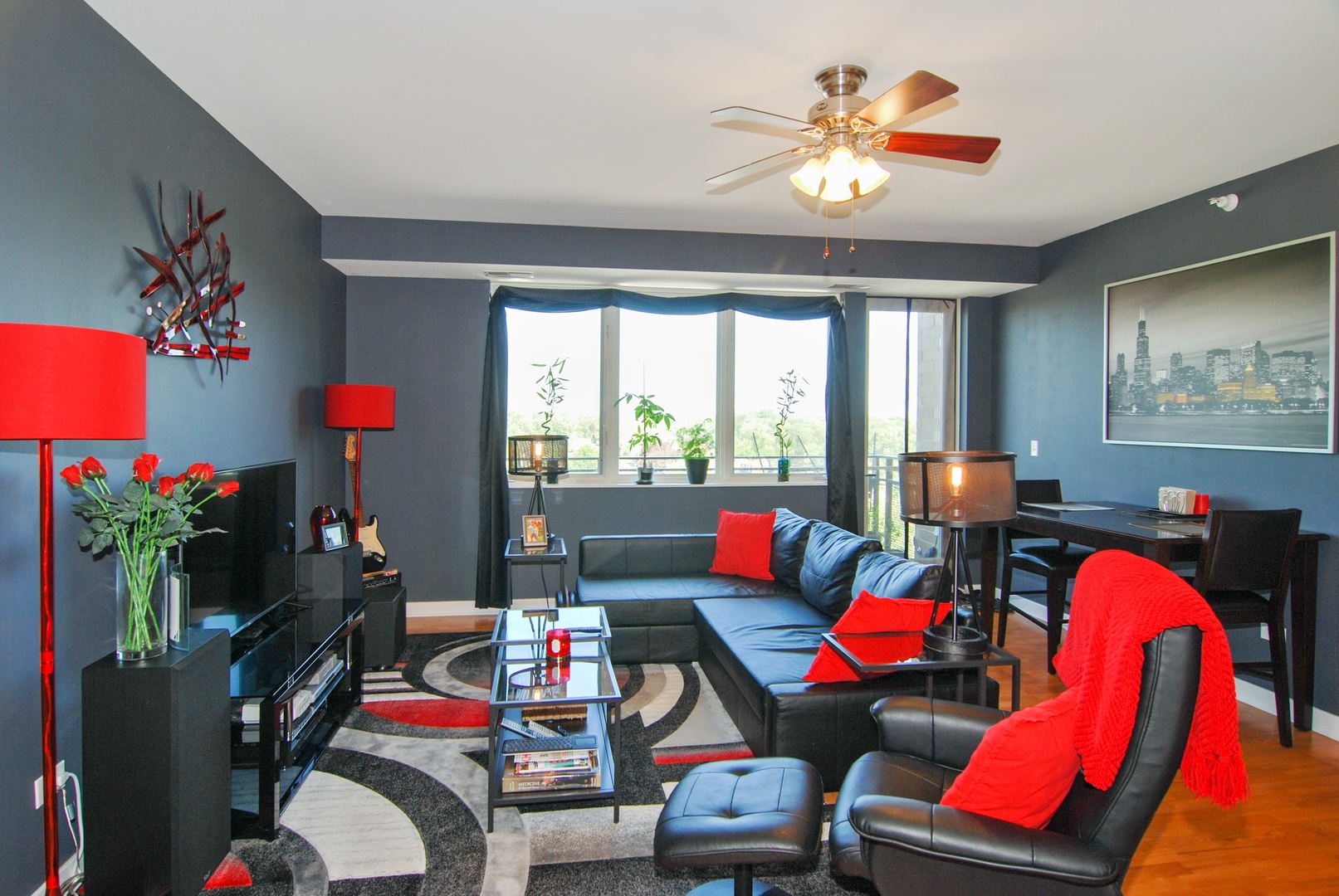 1905 South Wolf Road, Unit 605 Hillside, IL 60162 - Photo 4 of 31 a living room with furniture a rug and a chandelier