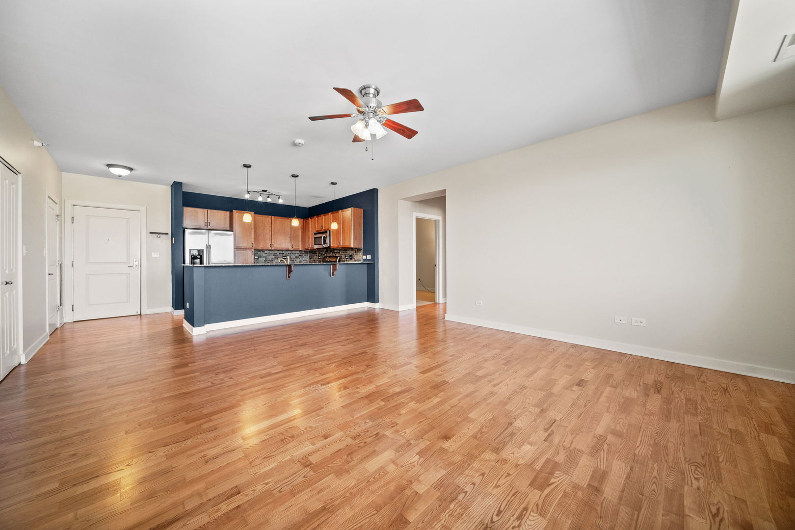 1905 South Wolf Road, Unit 605 Hillside, IL 60162 - Photo 5 of 31 wooden floor in an empty room with a window