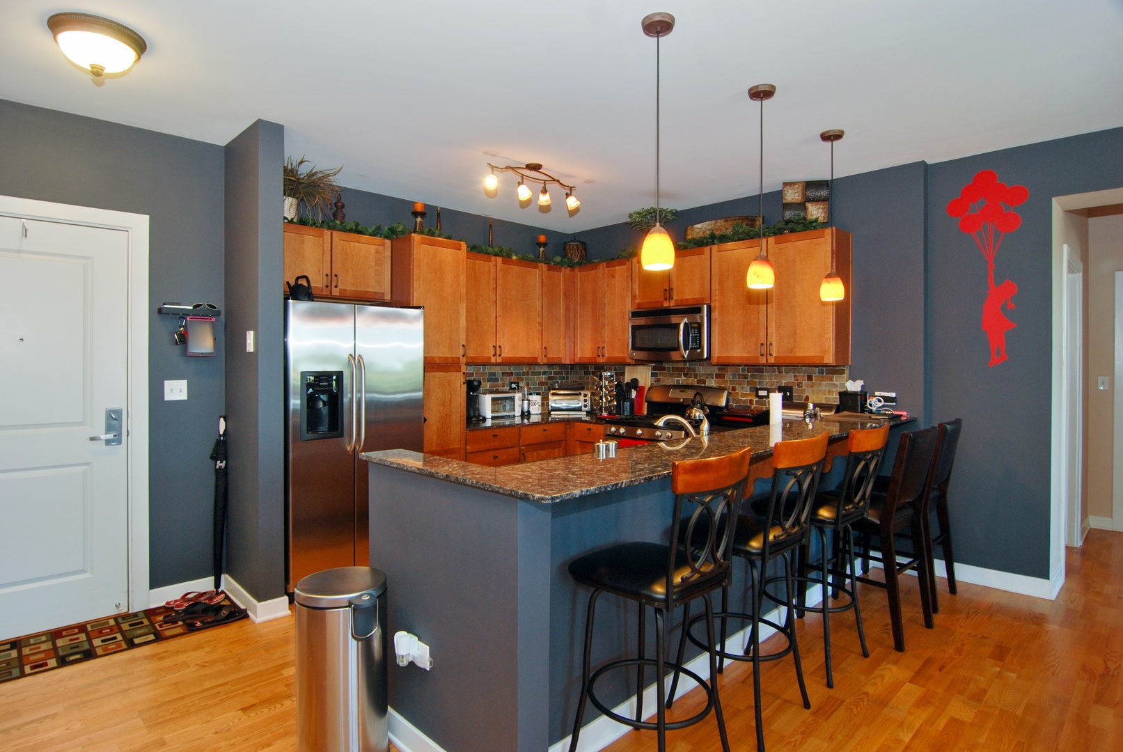 1905 South Wolf Road, Unit 605 Hillside, IL 60162 - Photo 6 of 31 a view of a dining area with furniture and a chandelier