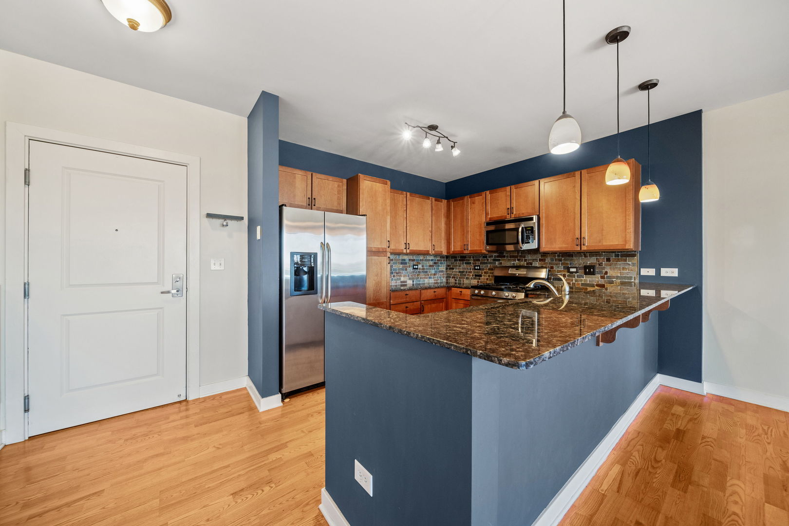 1905 South Wolf Road, Unit 605 Hillside, IL 60162 - Photo 7 of 31 a kitchen with stainless steel appliances granite countertop a sink a stove and a refrigerator