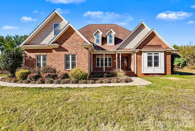 a front view of a house with a yard