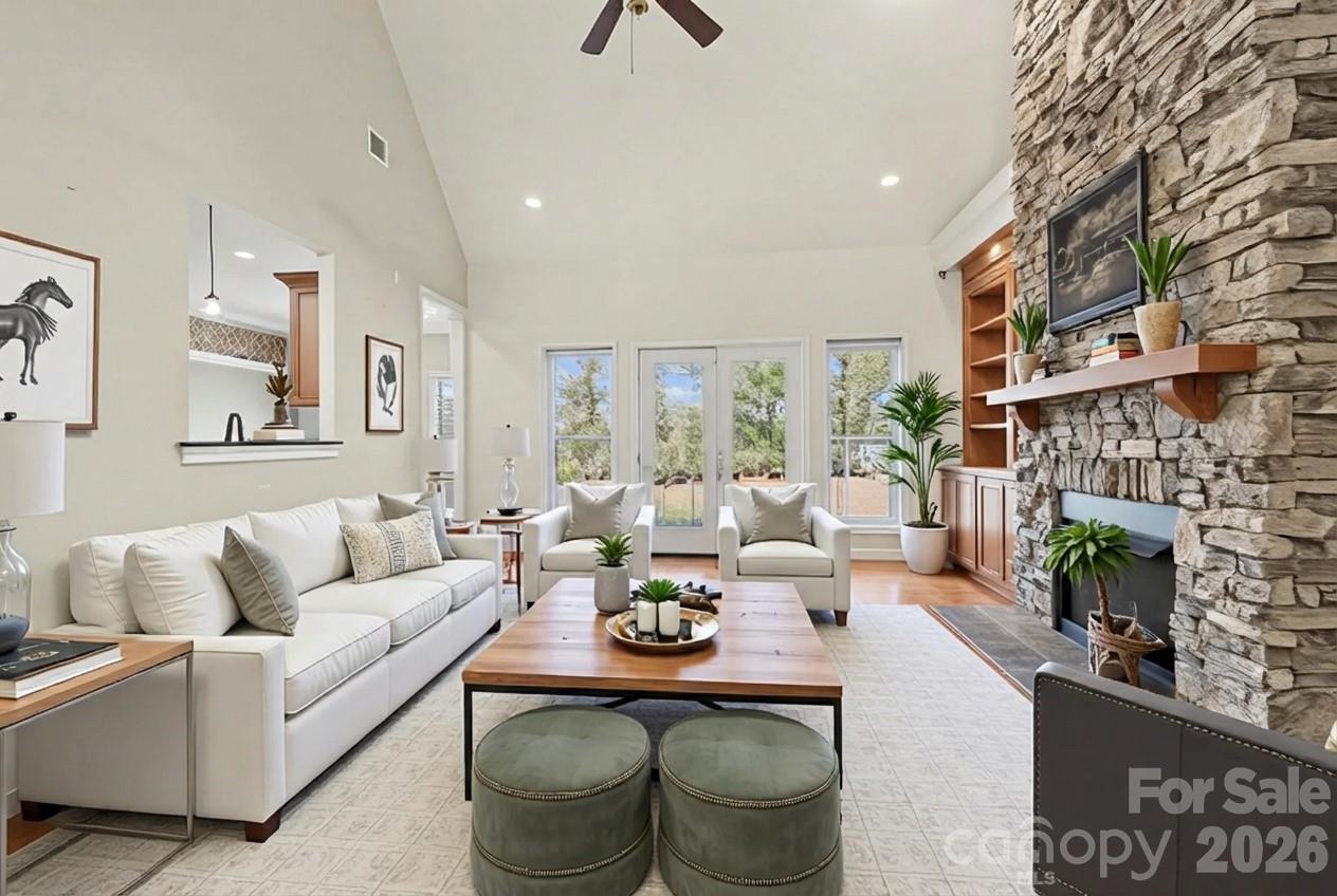 170 St James Way Salisbury, NC 28147 - Photo 11 of 27 a living room with furniture a fireplace and a large window