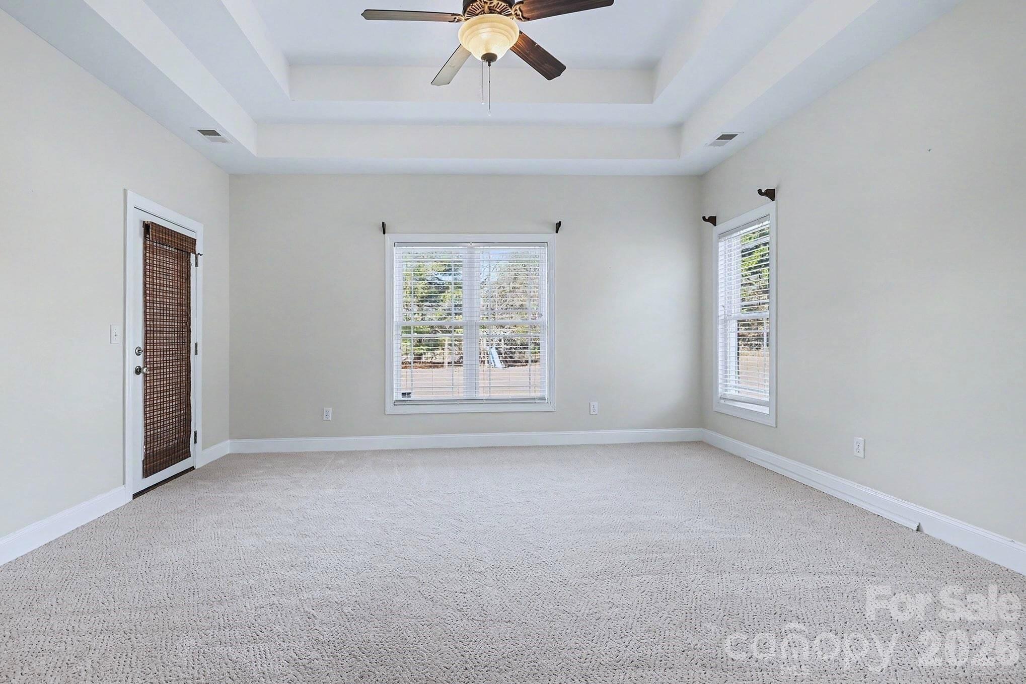 170 St James Way Salisbury, NC 28147 - Photo 15 of 27 an empty room with windows and fan