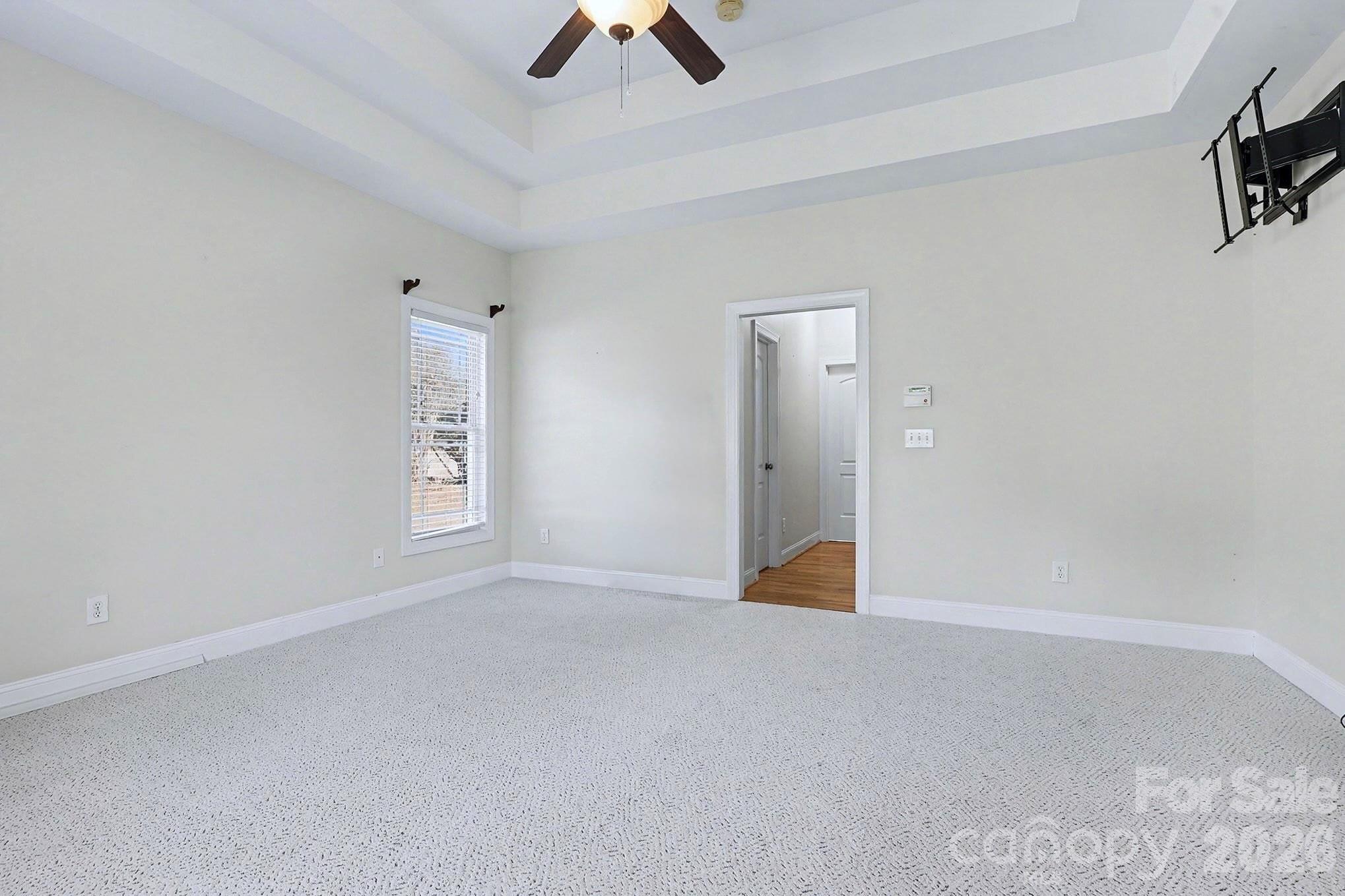 170 St James Way Salisbury, NC 28147 - Photo 16 of 27 an empty room with ceiling fan and window