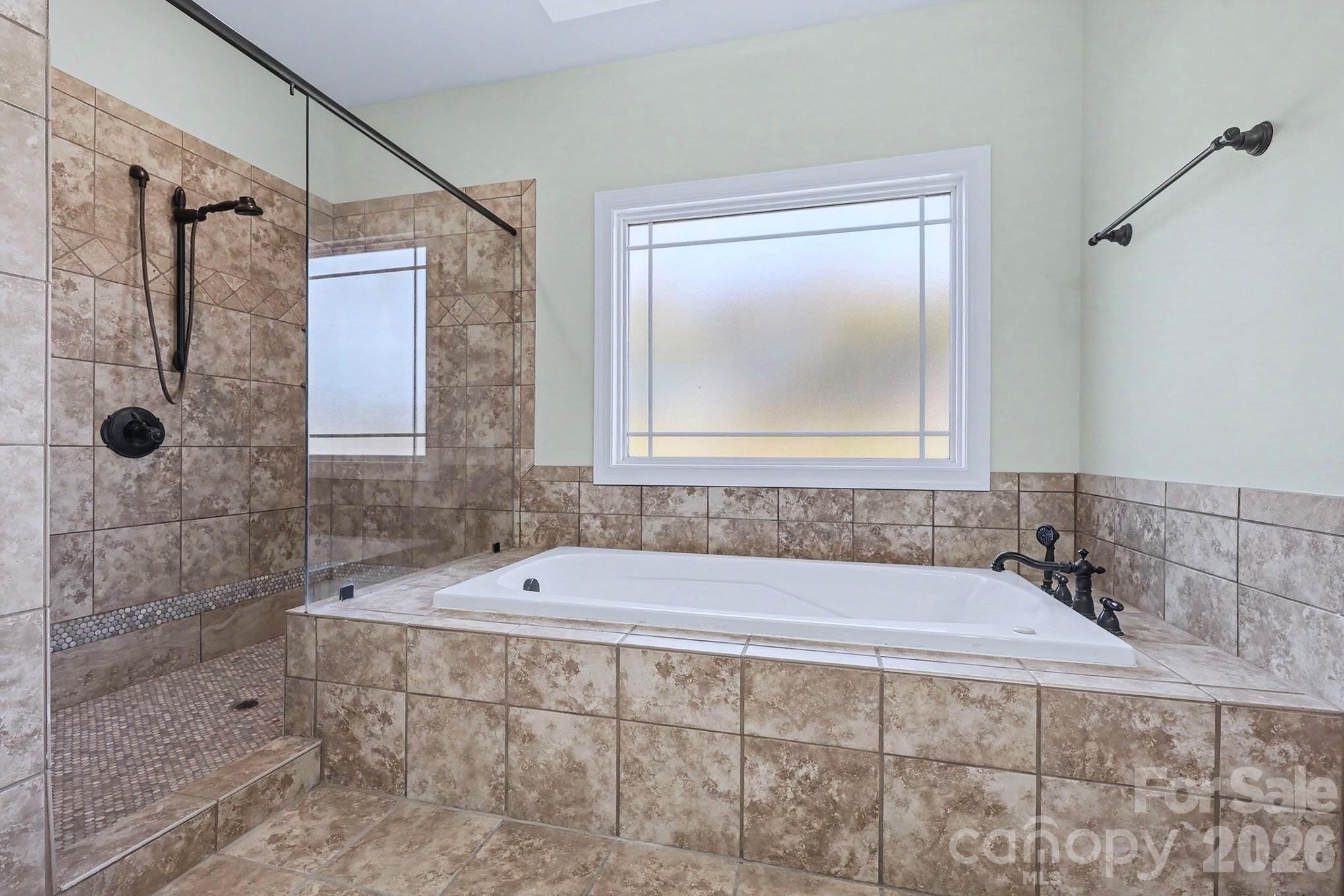 170 St James Way Salisbury, NC 28147 - Photo 17 of 27 a bathroom with a bathtub and shower