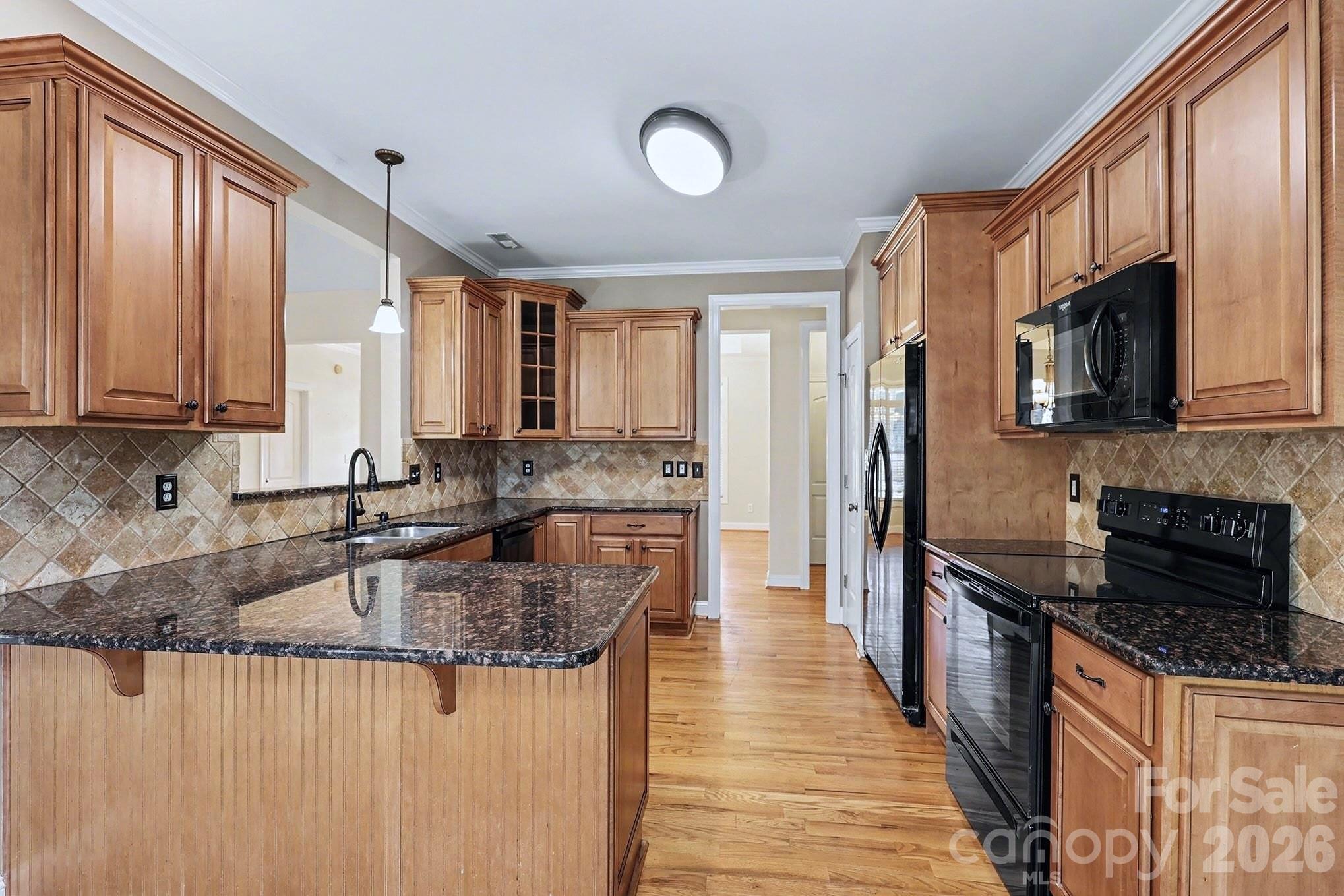 170 St James Way Salisbury, NC 28147 - Photo 8 of 27 a kitchen with stainless steel appliances granite countertop a sink stove and refrigerator