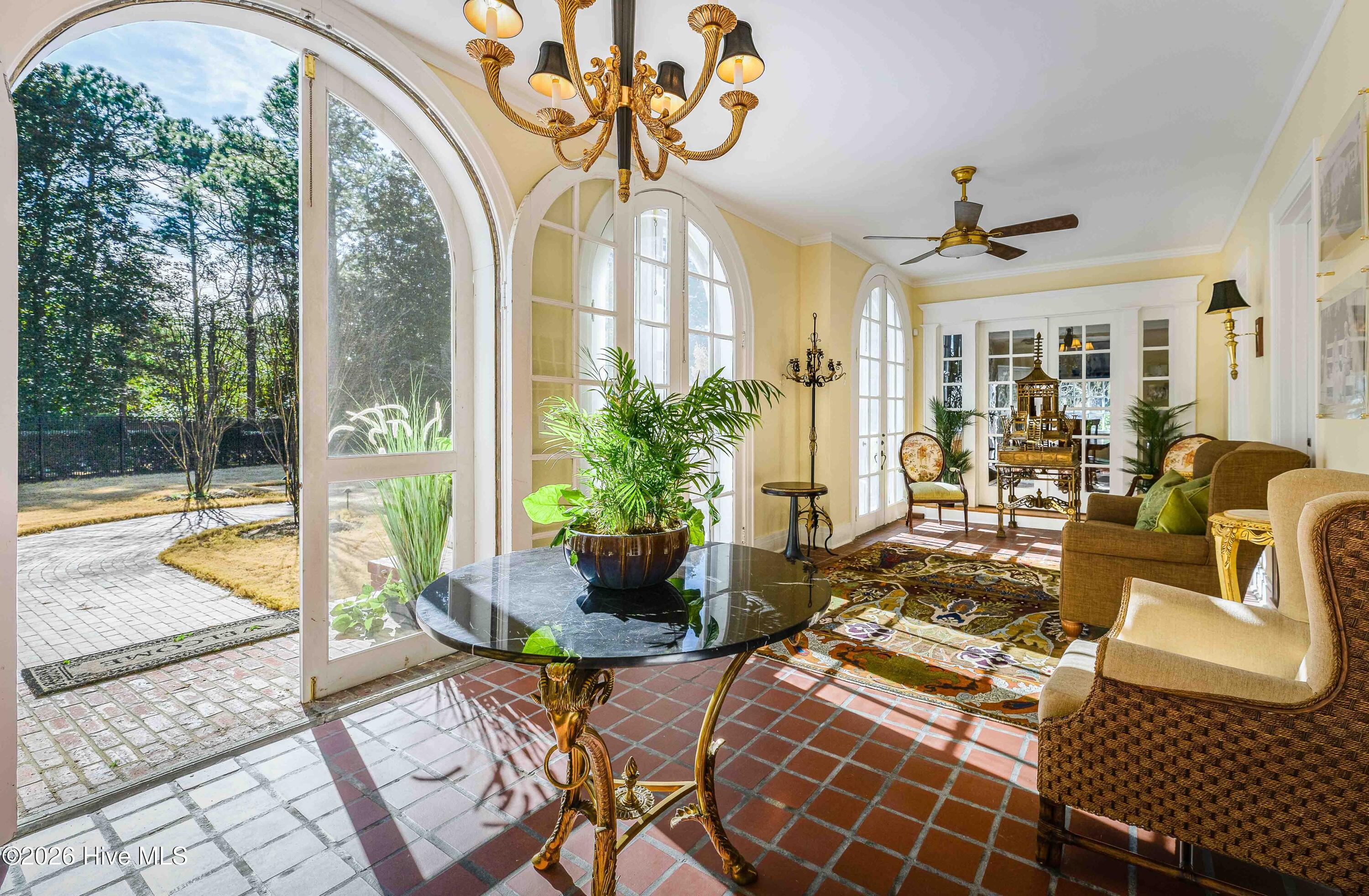12 Barrett Road East Pinehurst, NC 28374 - Photo 11 of 77 Arched french doors leading to the grand foyer through the loggia.