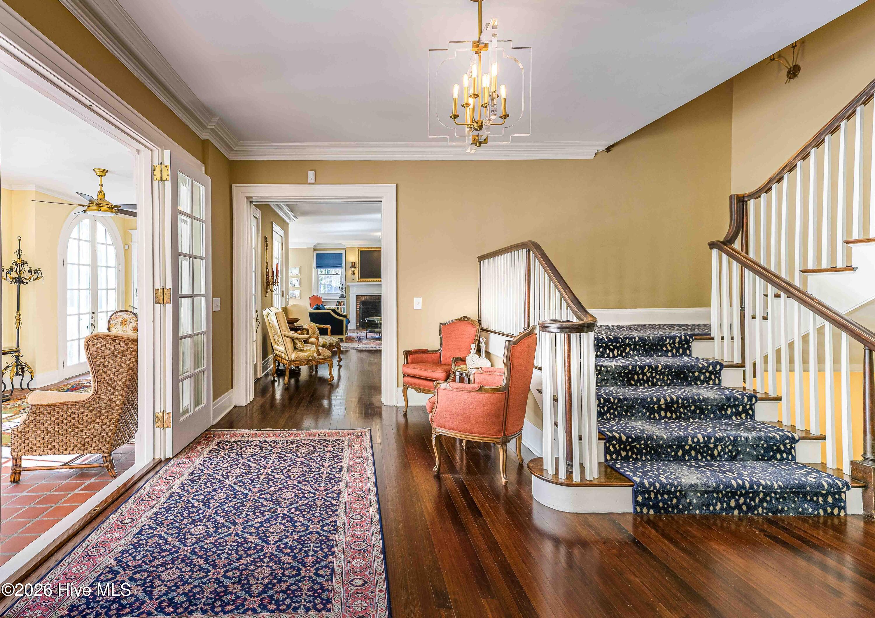 12 Barrett Road East Pinehurst, NC 28374 - Photo 13 of 77 Grand foyer with access to formal living room, formal dining room and half bath, staircases to second floor and basement, and kitchen areas.