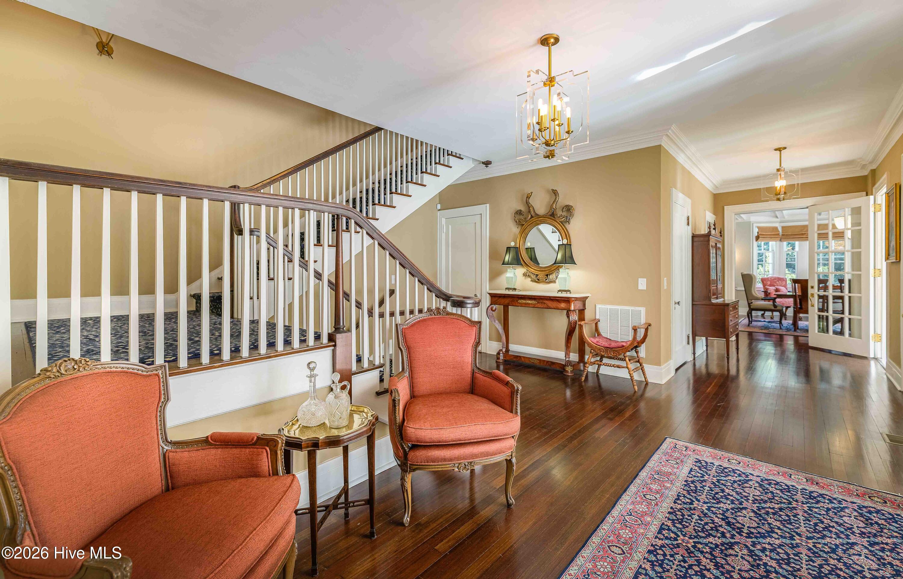 12 Barrett Road East Pinehurst, NC 28374 - Photo 14 of 77 Grand foyer with access to formal living room, formal dining room and half bath, staircases to second floor and basement, and kitchen areas.