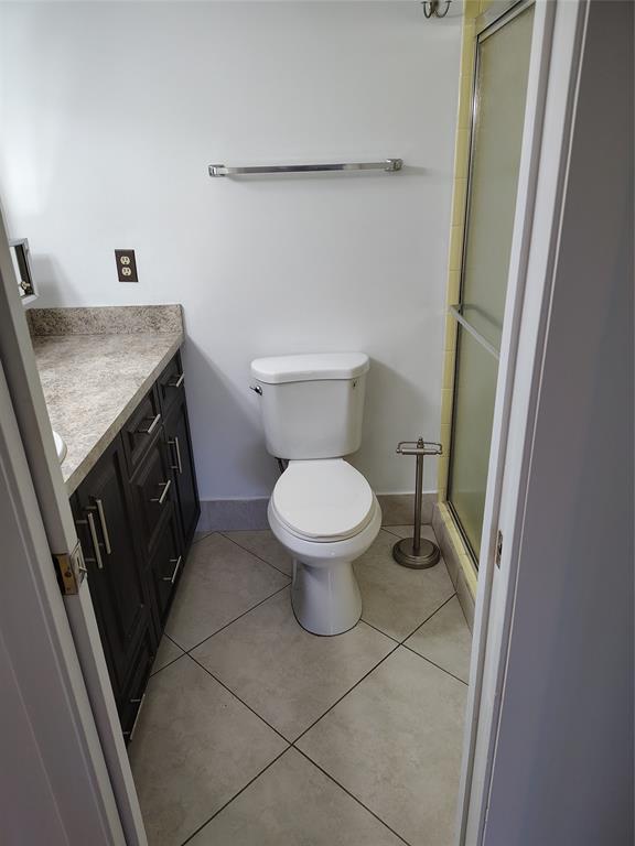 5245 Northwest 3rd Street, Unit D Delray Beach, FL 33445 - Photo 9 of 18 a bathroom with a granite countertop toilet and a sink