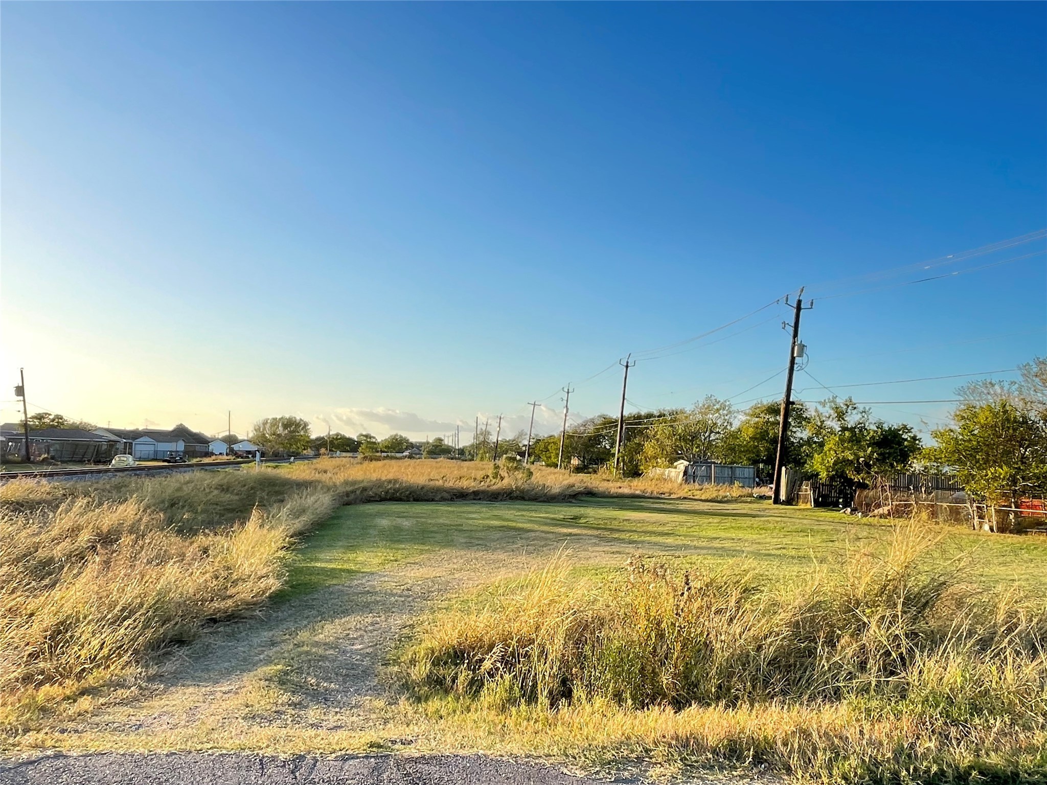 0 Ash Street Freeport, TX 77541 - Photo 2 of 9 a view of a lake with houses in the background
