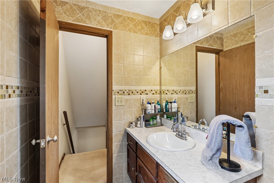 4702 Alger Road Richfield, OH 44286 - Photo 27 of 46 Bathroom vanity featuring a single basin sink and a laminate countertop