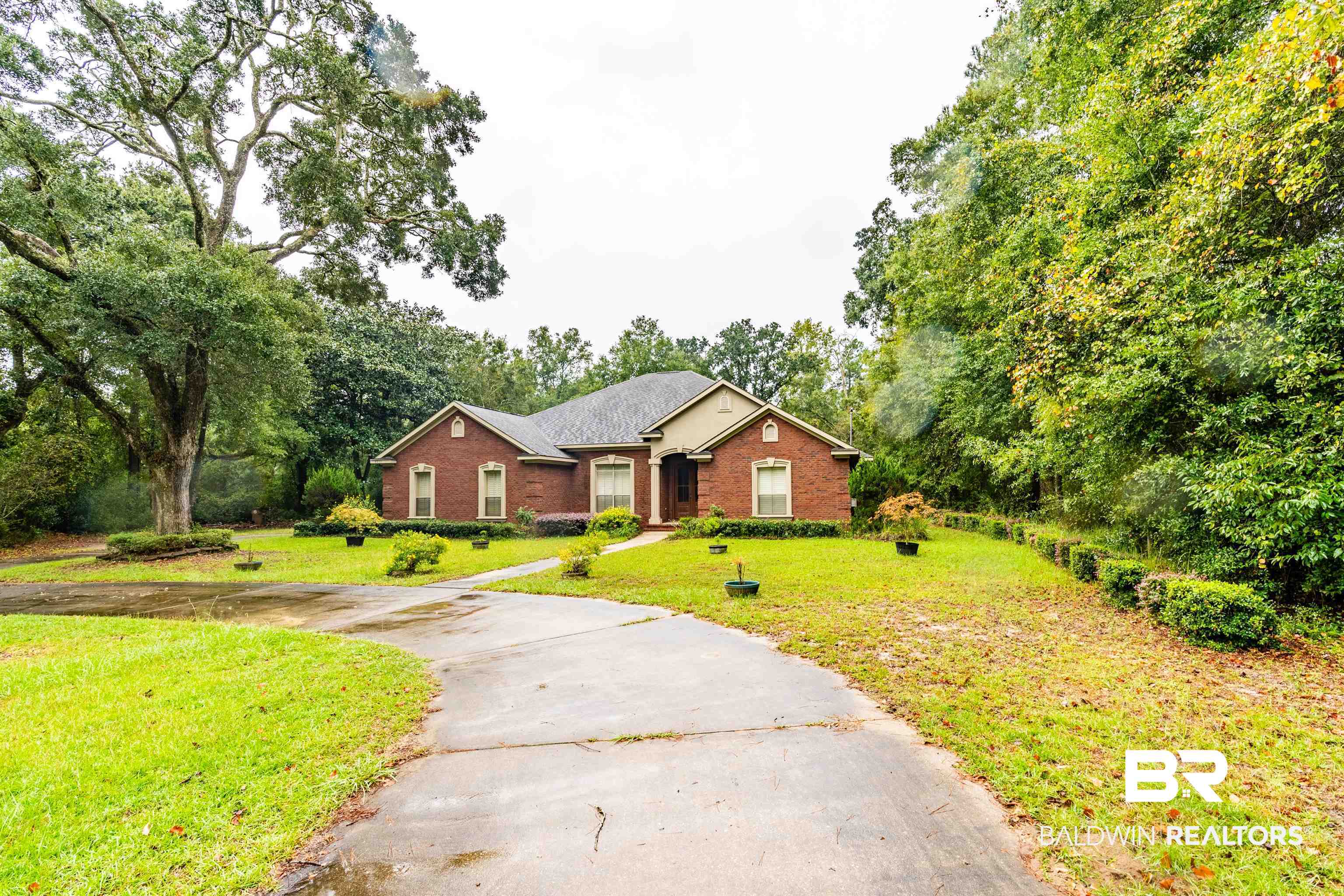 4055 Riviere Du Chien Road Mobile, AL 36693 - Photo 62 of 63 Ranch-style home featuring a front yard