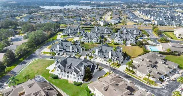an aerial view of residential house with outdoor space and swimming pool