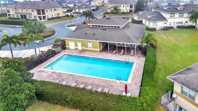 an aerial view of a house with a swimming pool