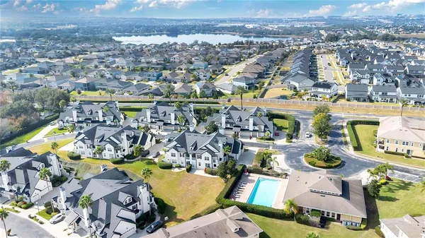 an aerial view of a swimming pool patio and mountain view