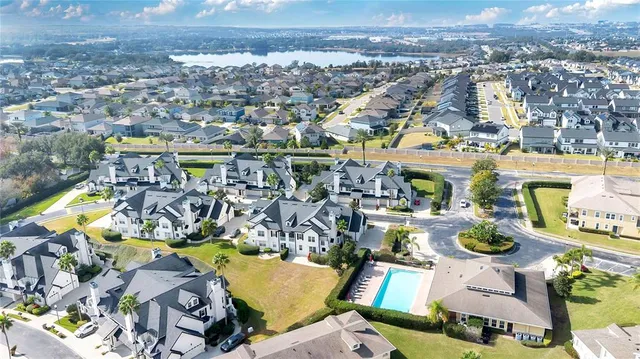 an aerial view of a swimming pool patio and mountain view