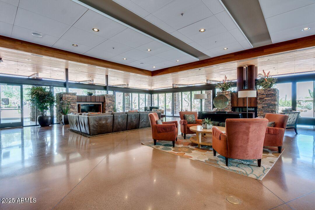 3935 East Rough Rider Road, Unit 1267 Phoenix, AZ 85050 - Photo 22 of 37 a living room with furniture and a large window