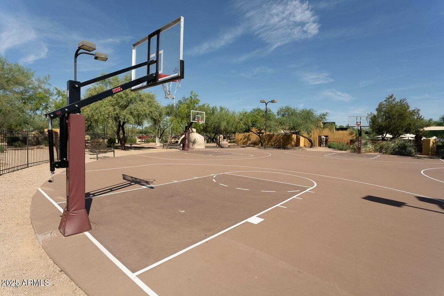 3935 East Rough Rider Road, Unit 1267 Phoenix, AZ 85050 - Photo 26 of 37 a view of a street with a building in the background