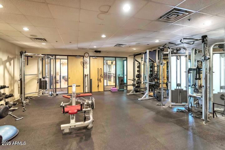 3935 East Rough Rider Road, Unit 1267 Phoenix, AZ 85050 - Photo 29 of 37 a view of a room with gym equipment