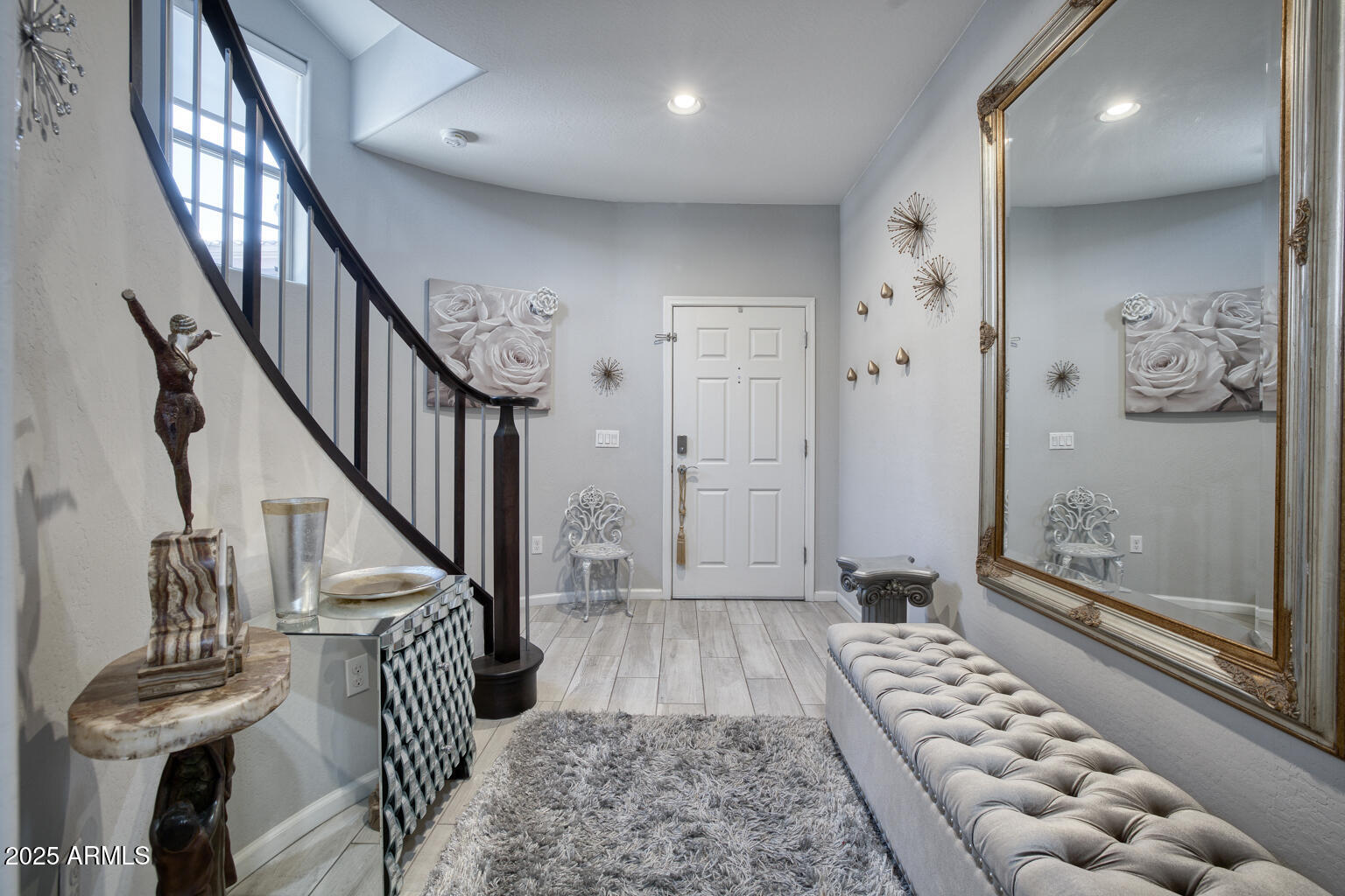 3935 East Rough Rider Road, Unit 1267 Phoenix, AZ 85050 - Photo 3 of 37 a view of entryway with wooden floor
