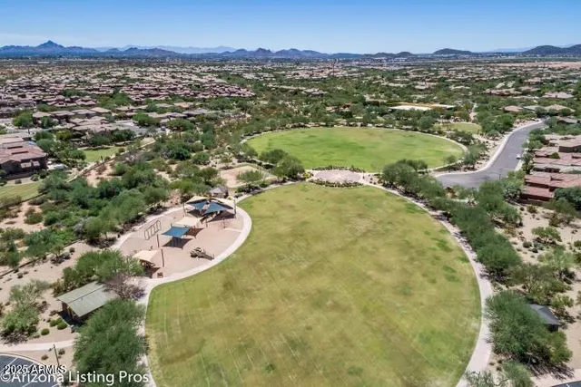 a view of a lake with a house and outdoor space