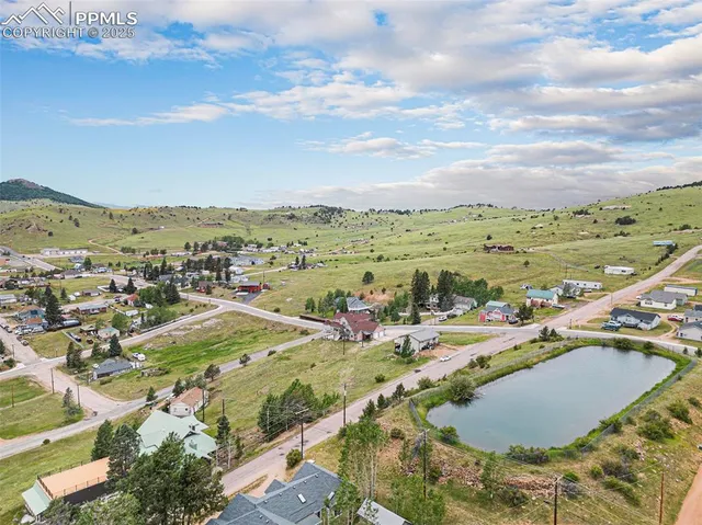 an aerial view of residential houses with outdoor space