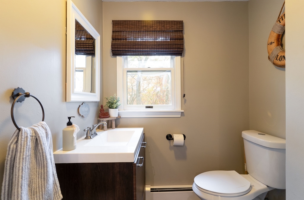 15 Cherokee Road Holland, MA 01521 - Photo 13 of 42 a bathroom with a sink a toilet and mirror