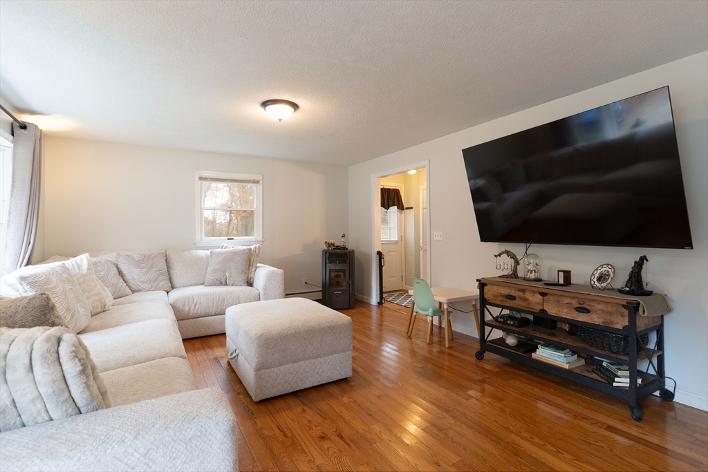 15 Cherokee Road Holland, MA 01521 - Photo 21 of 42 a living room with furniture and a flat screen tv