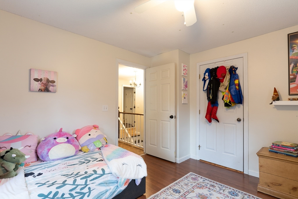 15 Cherokee Road Holland, MA 01521 - Photo 25 of 42 a bedroom with a bed and wooden floor