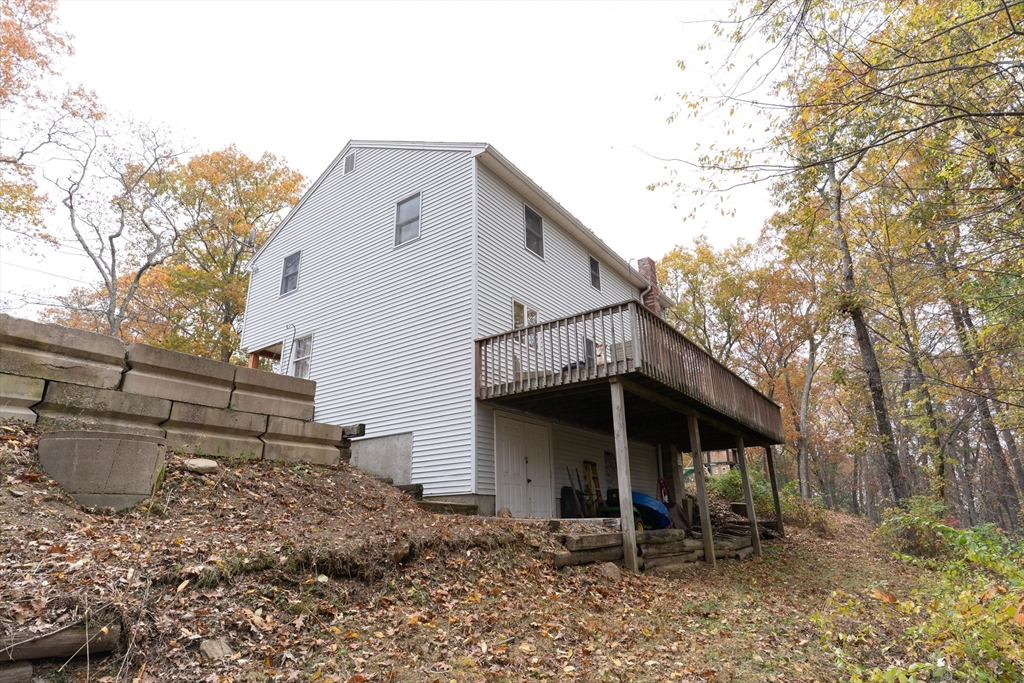 15 Cherokee Road Holland, MA 01521 - Photo 37 of 42 a front view of a house with garden