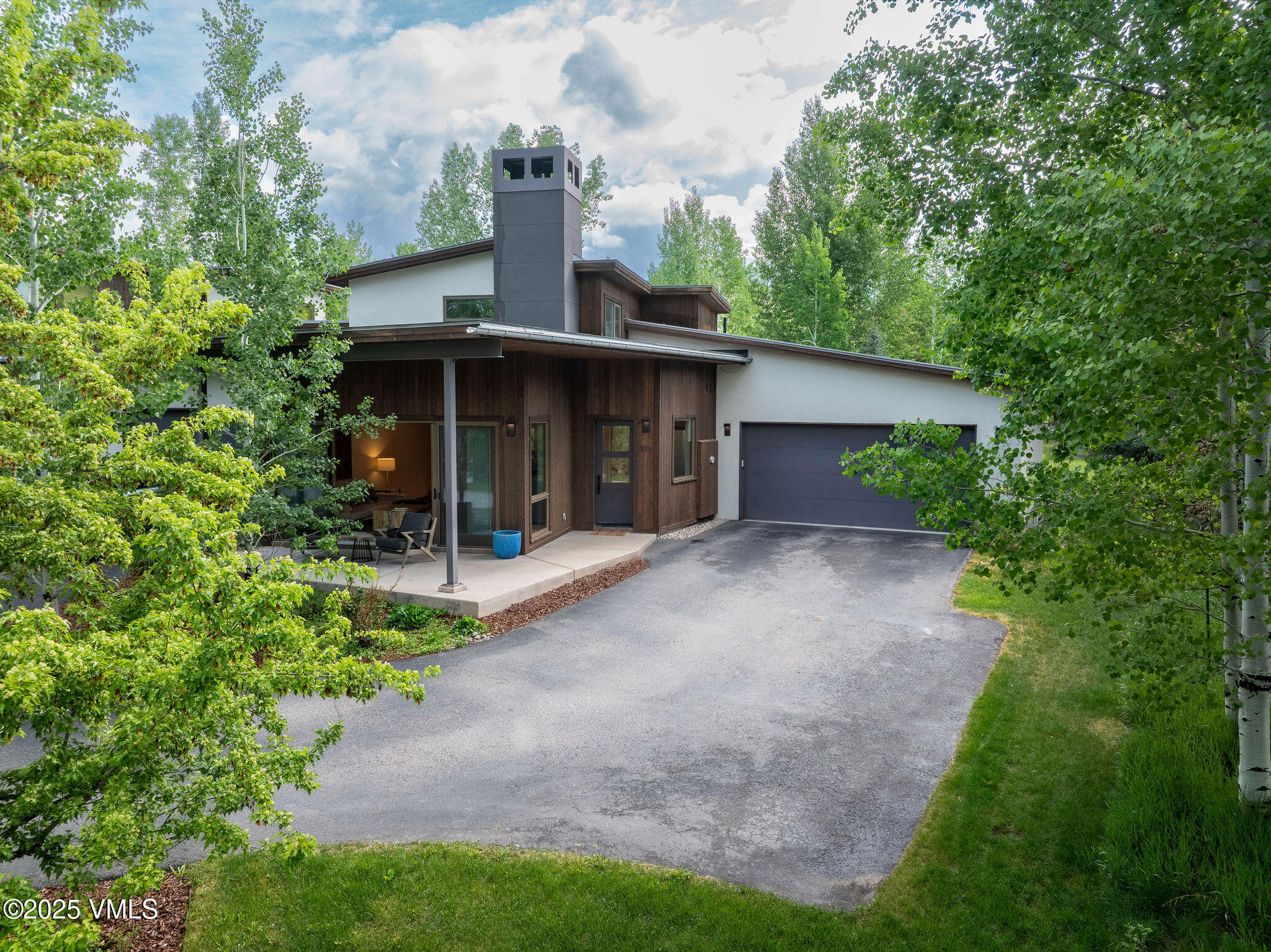 232 Stetson Drive Edwards, CO 81632 - Photo 1 of 25 a front view of a house with a yard and trees