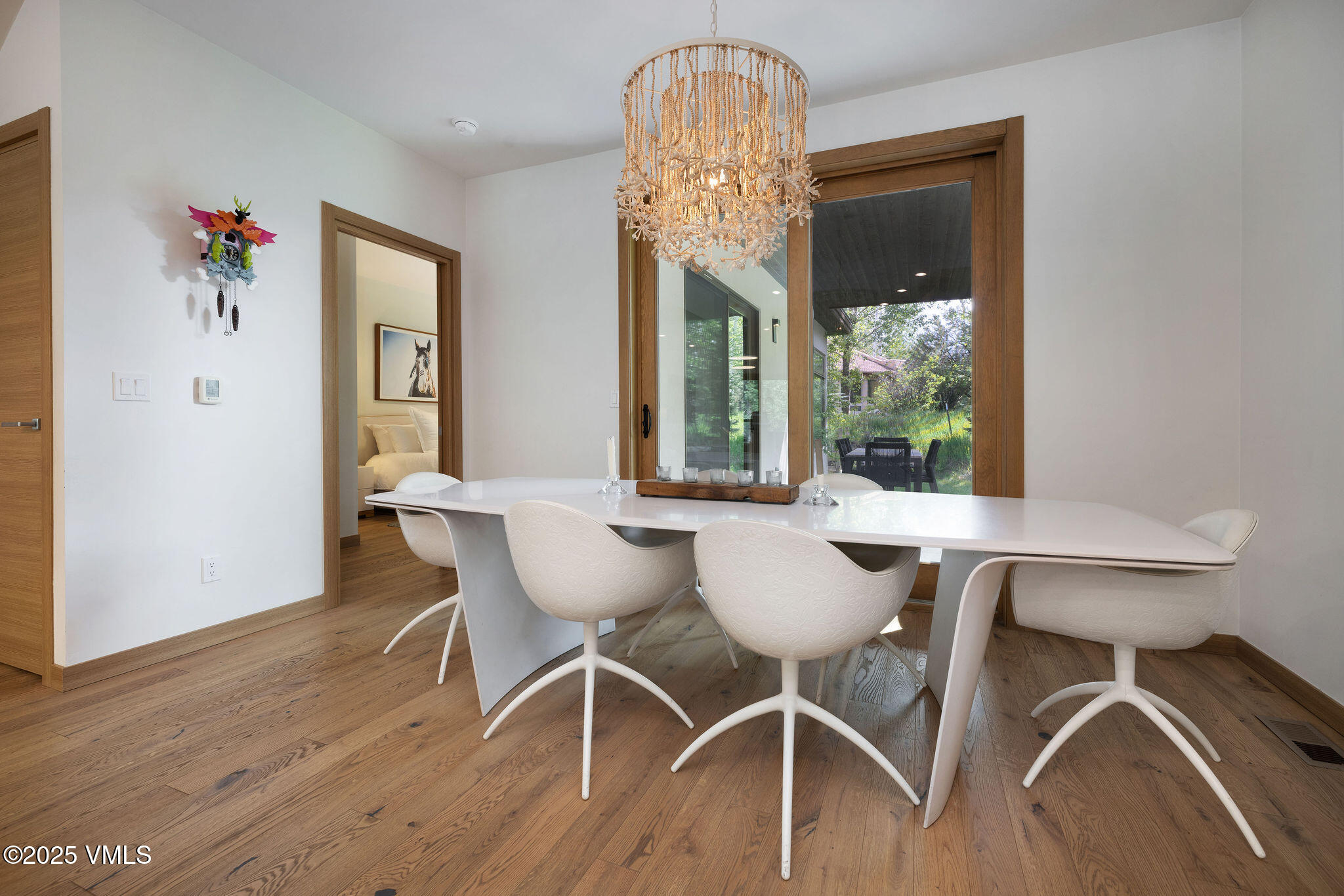 232 Stetson Drive Edwards, CO 81632 - Photo 12 of 25 a view of a dining room with furniture wooden floor and a chandelier