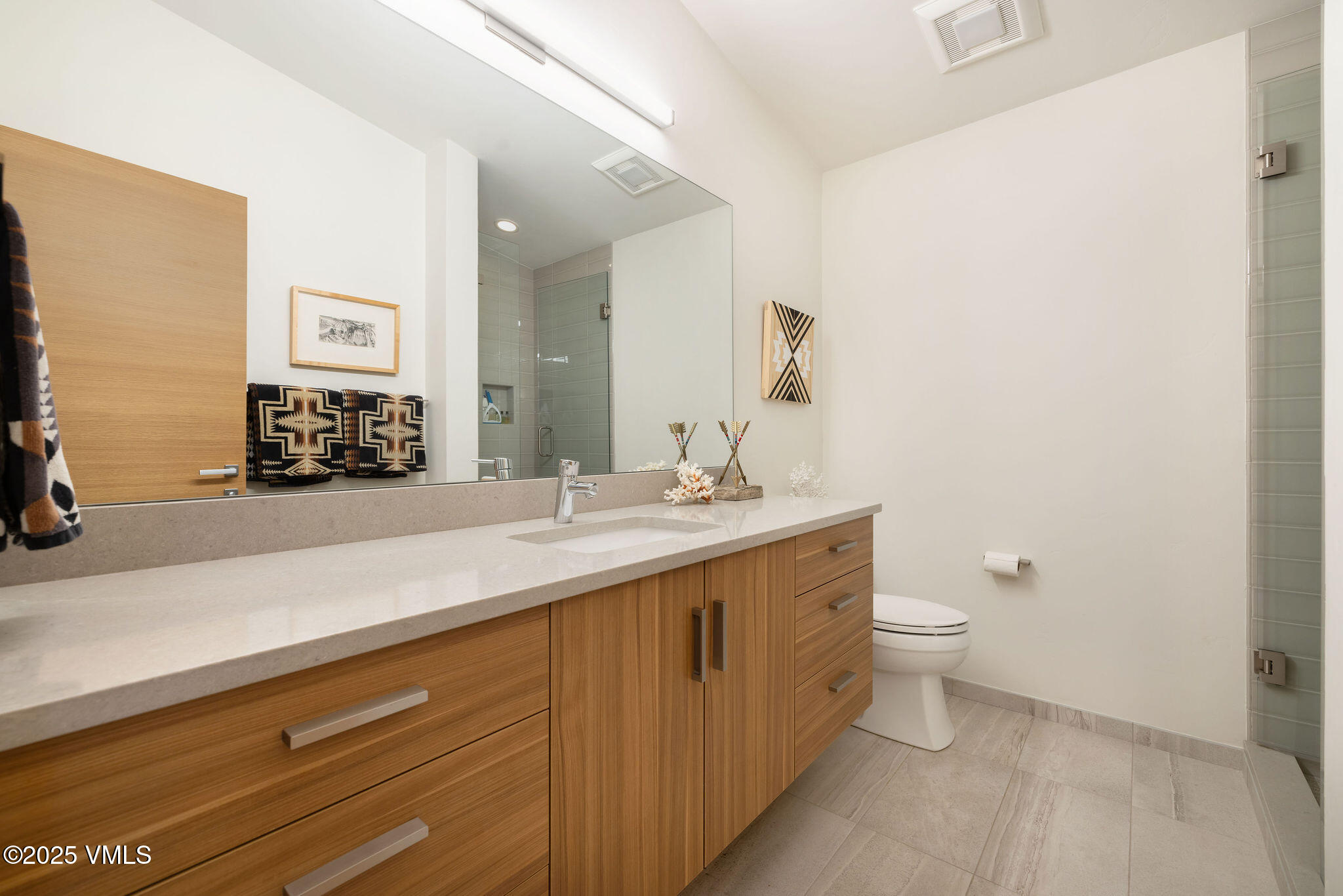 232 Stetson Drive Edwards, CO 81632 - Photo 19 of 25 a bathroom with a double vanity sink and a mirror