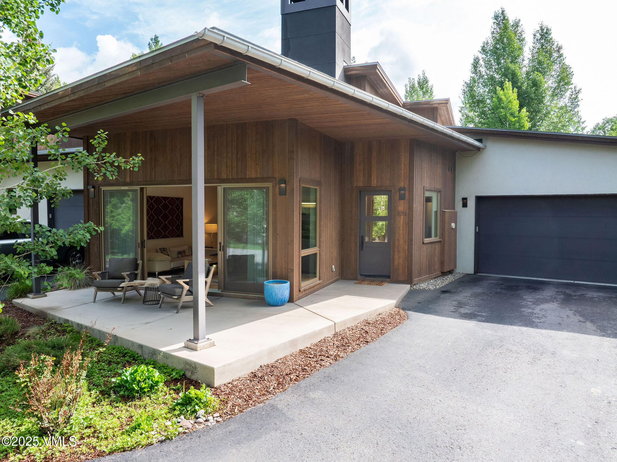 232 Stetson Drive Edwards, CO 81632 - Photo 2 of 25 a front view of a house with a yard and potted plants