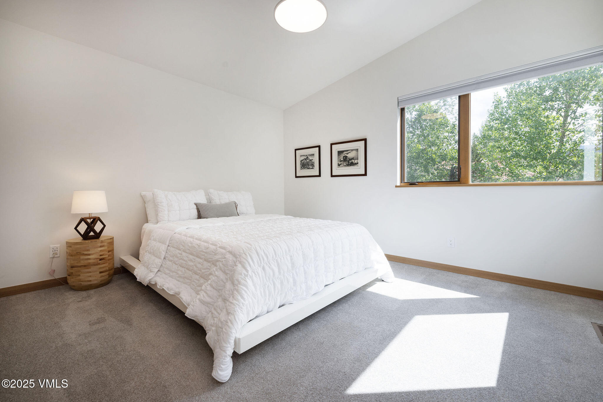 232 Stetson Drive Edwards, CO 81632 - Photo 21 of 25 a bedroom with a bed and a large window