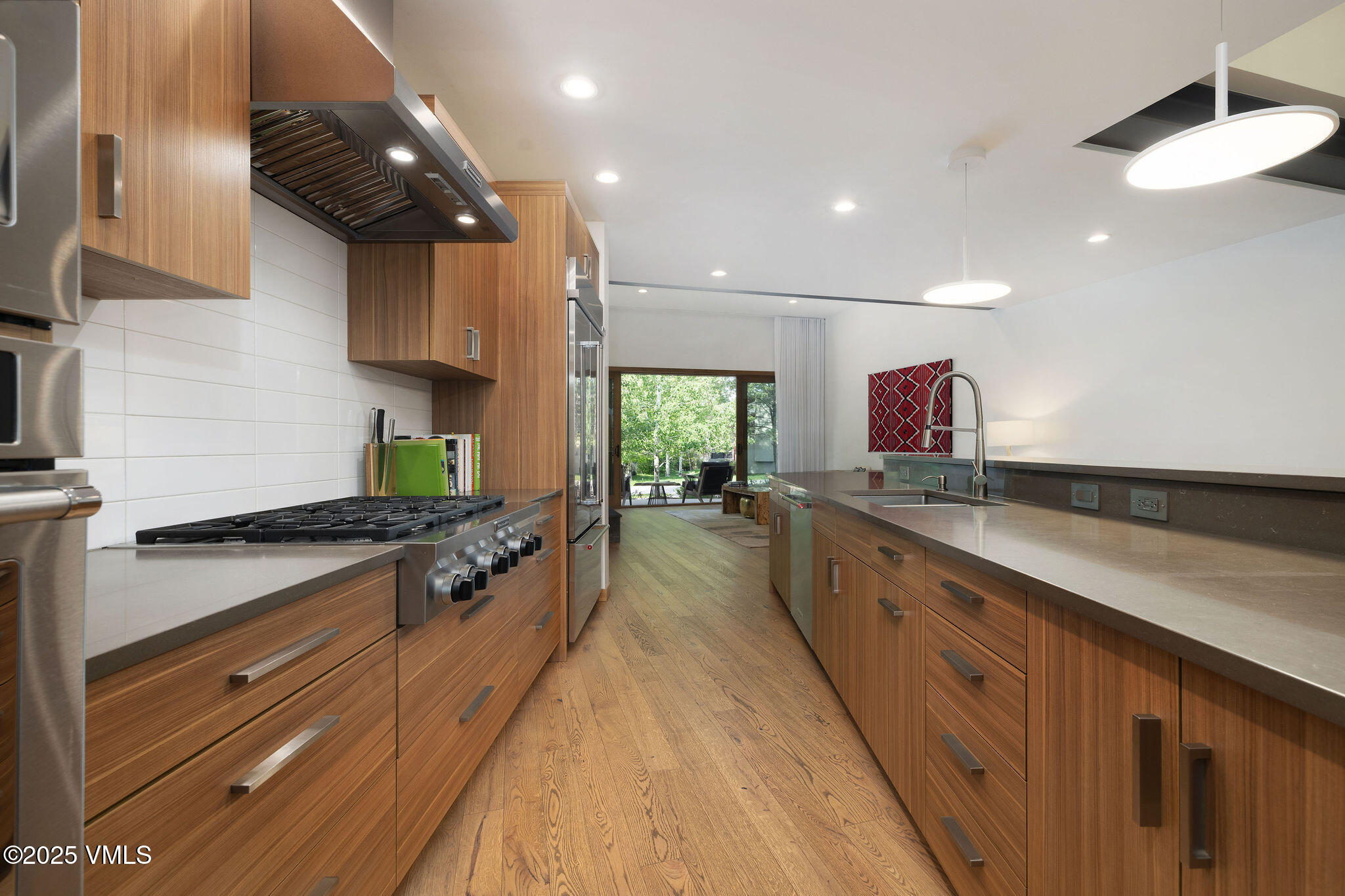 232 Stetson Drive Edwards, CO 81632 - Photo 4 of 25 a large kitchen with stainless steel appliances a large counter top a stove and a sink