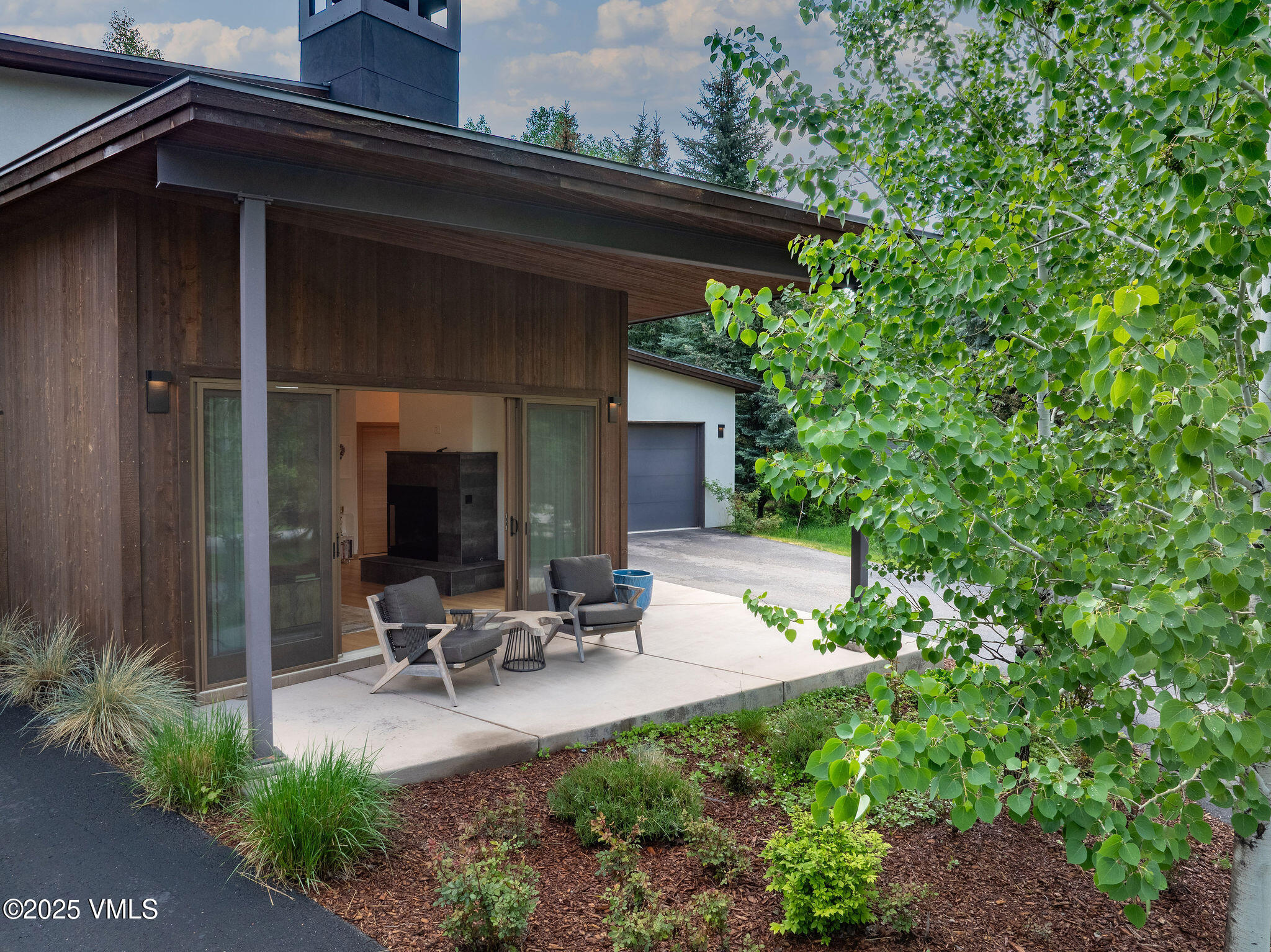 232 Stetson Drive Edwards, CO 81632 - Photo 10 of 25 a view of backyard with wheel chair potted plants and large tree