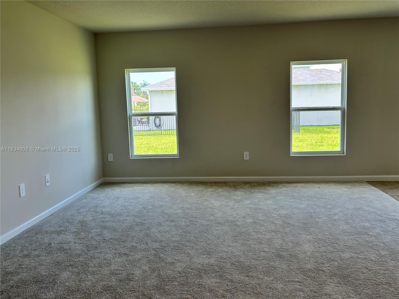 217 Raspberry Road Fort Pierce, FL 34981 - Photo 14 of 39 an empty room with a window and a fireplace