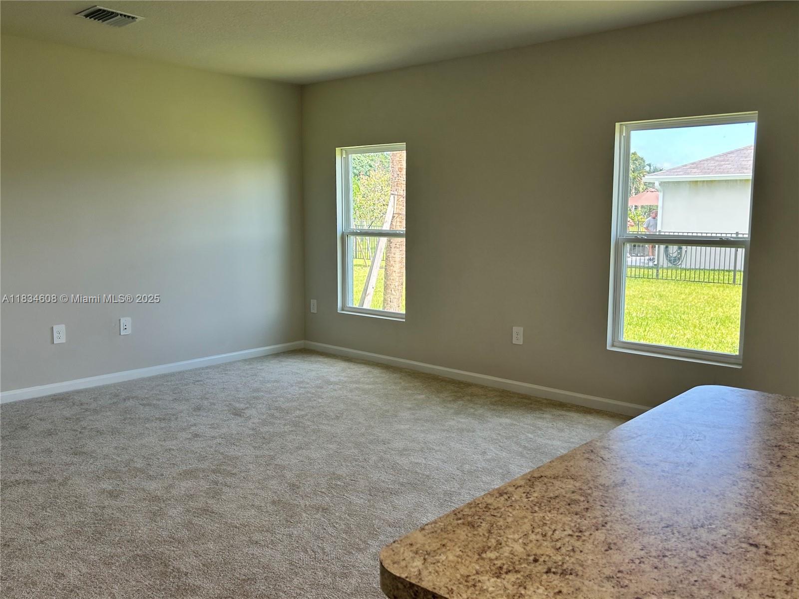217 Raspberry Road Fort Pierce, FL 34981 - Photo 16 of 39 an empty room with windows