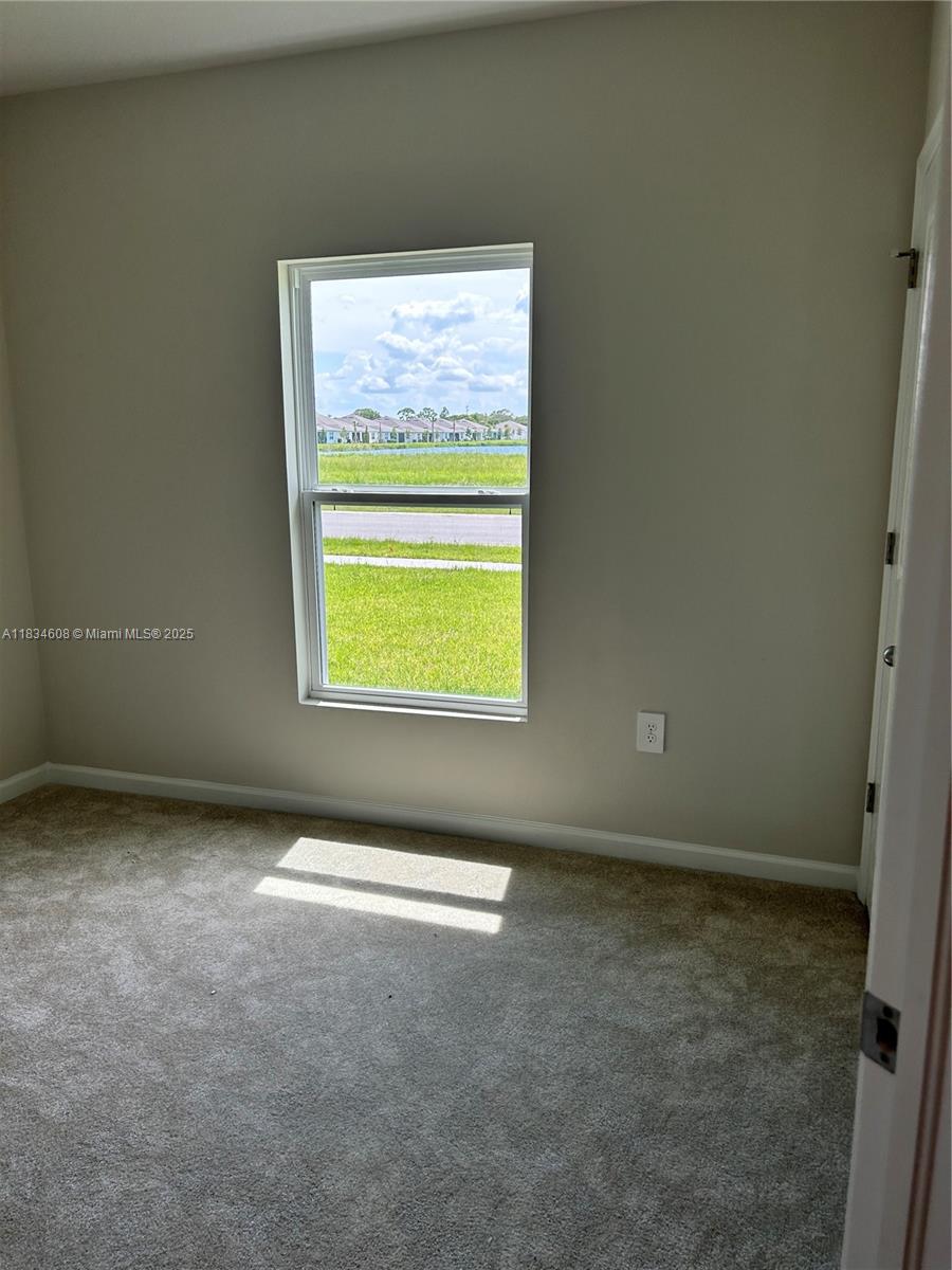 217 Raspberry Road Fort Pierce, FL 34981 - Photo 21 of 39 a view of an empty room with a window