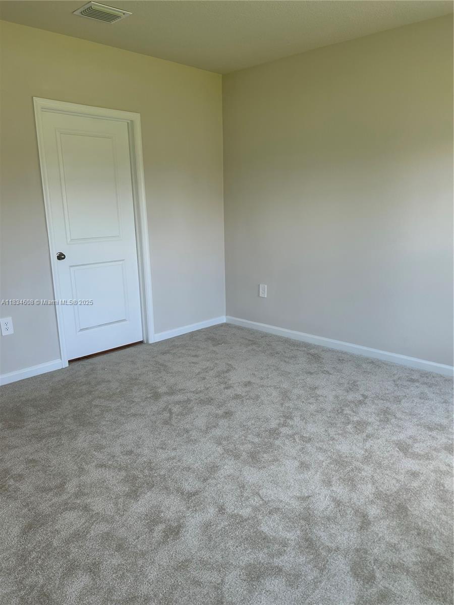 217 Raspberry Road Fort Pierce, FL 34981 - Photo 22 of 39 an empty room with closet area