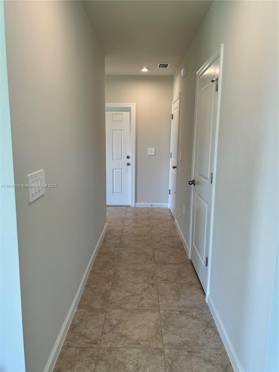 217 Raspberry Road Fort Pierce, FL 34981 - Photo 3 of 39 a view of a hallway