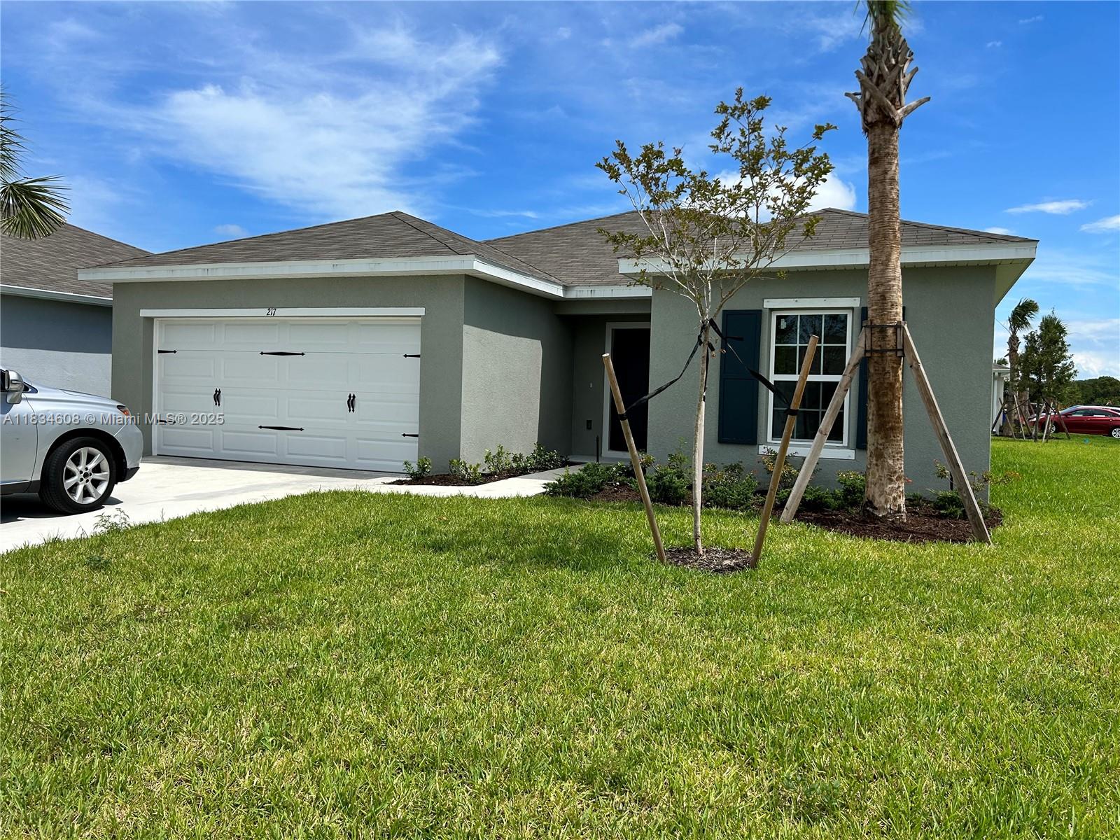 217 Raspberry Road Fort Pierce, FL 34981 - Photo 32 of 39 a view of a house with a yard