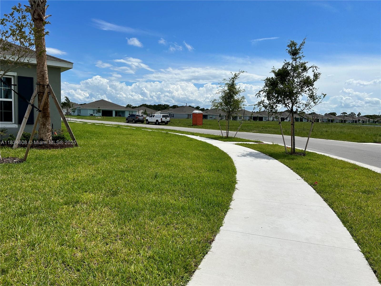 217 Raspberry Road Fort Pierce, FL 34981 - Photo 34 of 39 a view of a garden with a slide